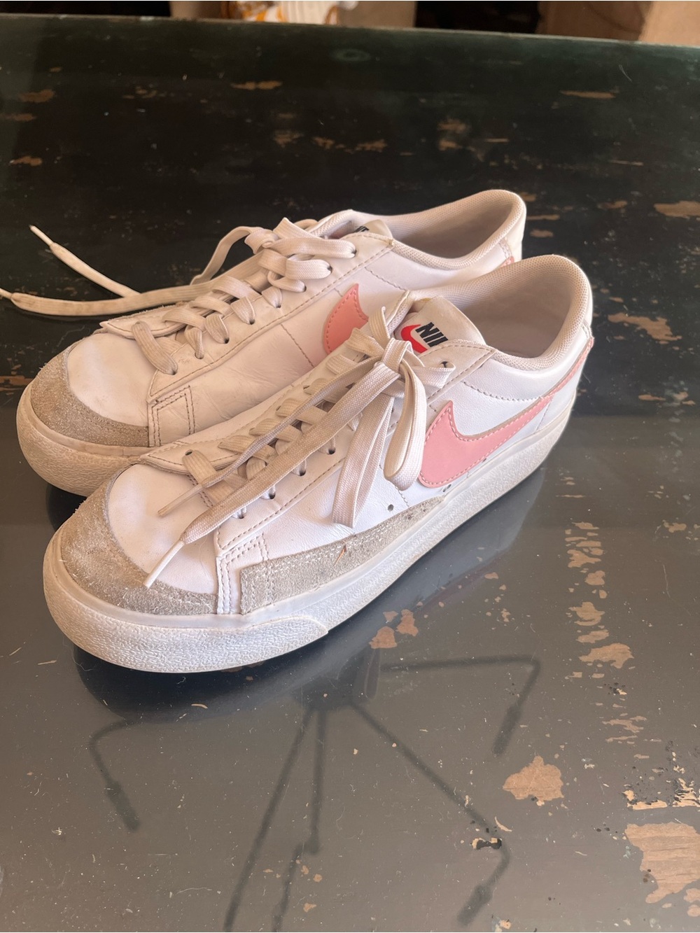 Nike Women’s White Sneakers with Pink Swoosh Accent